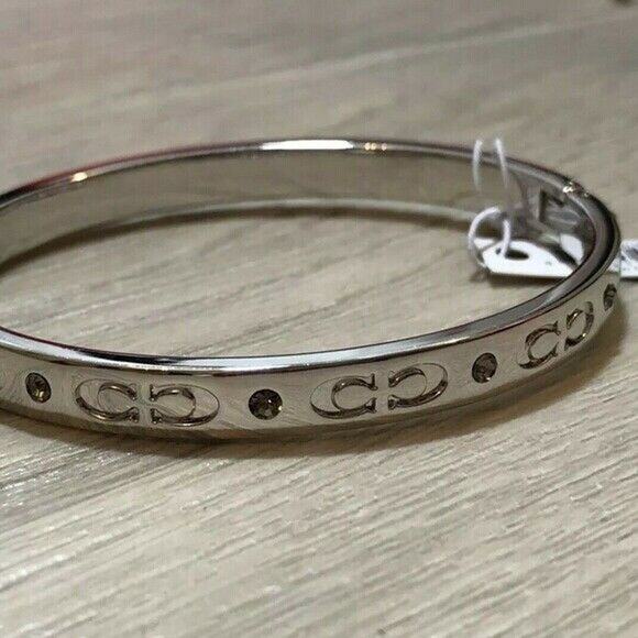 COACH SILVER TONE KISSING C HINGED BANGLE BRACELET - Picture 2 of 10